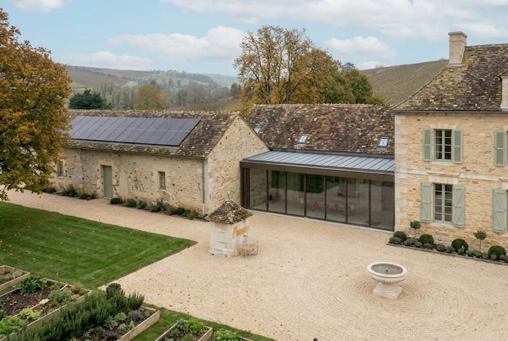 The contemporary glazed junction and the solar outbuilding