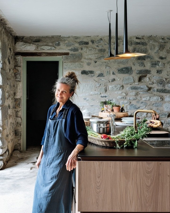 The steward in the estate kitchen, beside garden produce