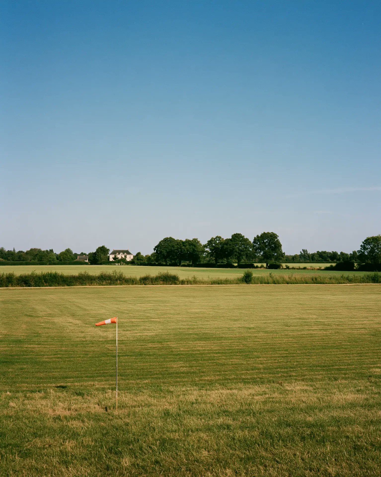 Open meadow with a windsock