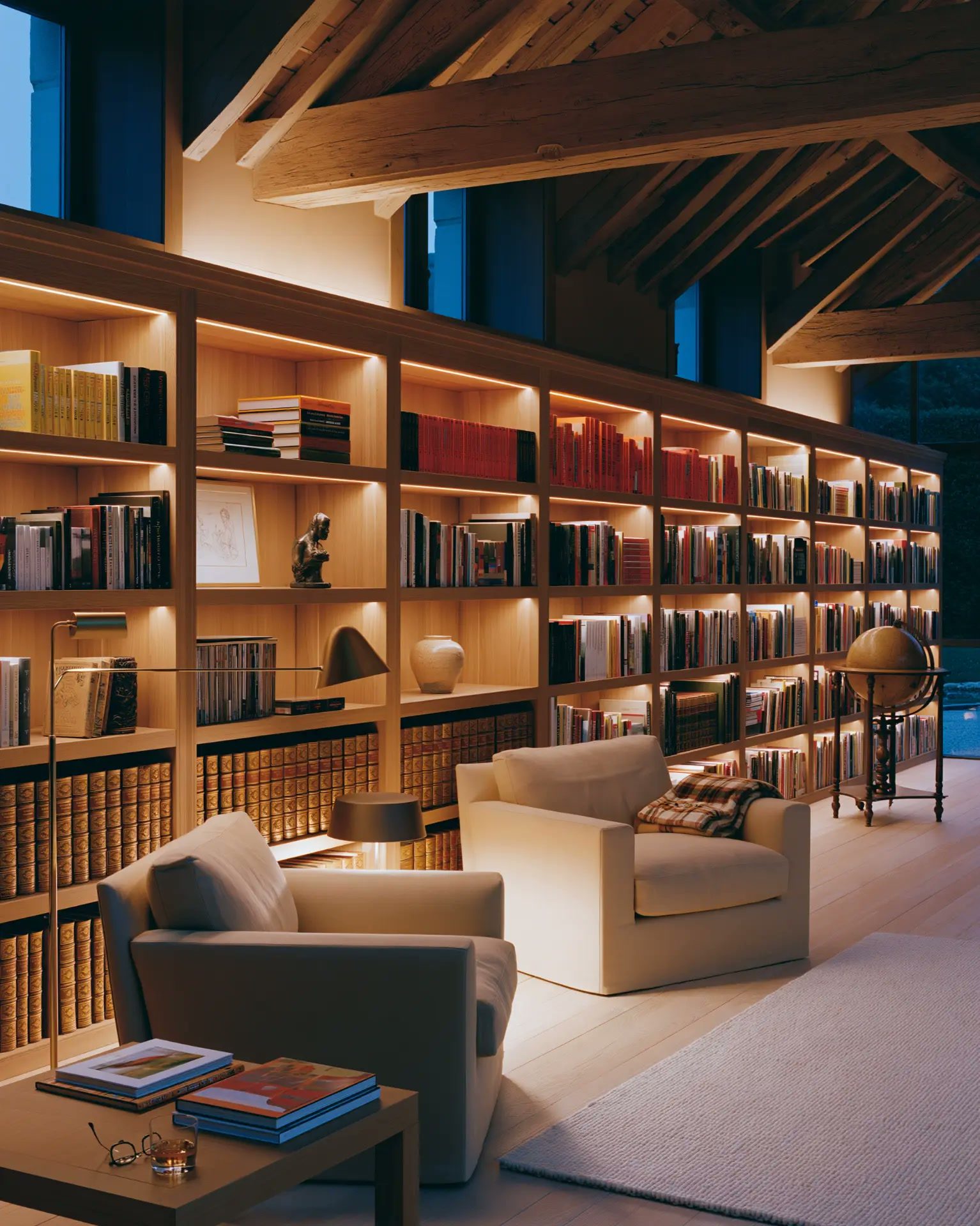 Library under the roof timbers, soft lighting